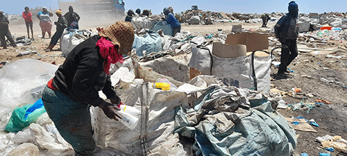 Foraging for a living on a dumpsite… desperate women find joy in the rubble