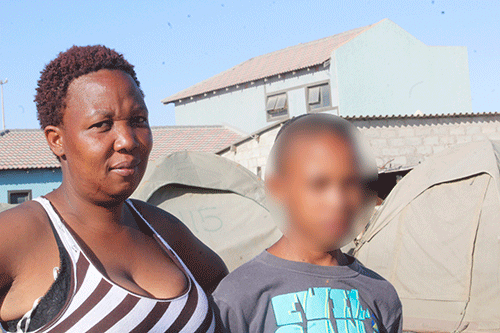 Mother pleads son’s innocence in shack fire
