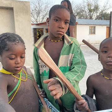 Angolan minors scrounge in  bins for food