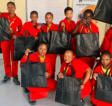 San women trained to produce clothing