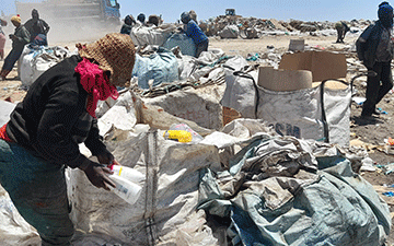 Foraging for a living on a dumpsite… desperate women find joy in the rubble