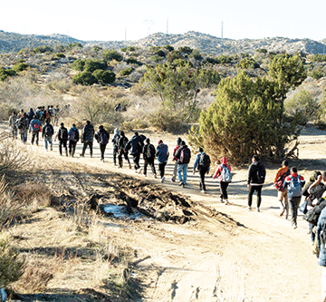 ‘A new normal’: Migrants huddle in open-air camps on US border