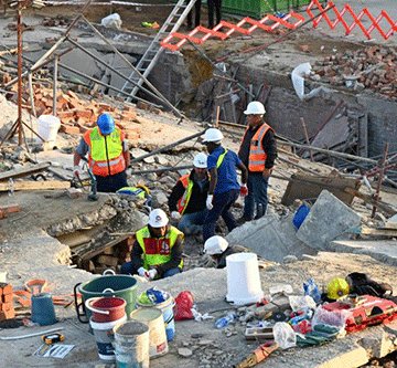 trapped SA rescuers in contact with 11 trapped in collapsed building