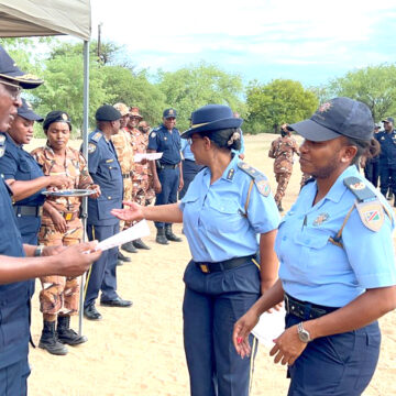 Police climb ladder in Kavango East