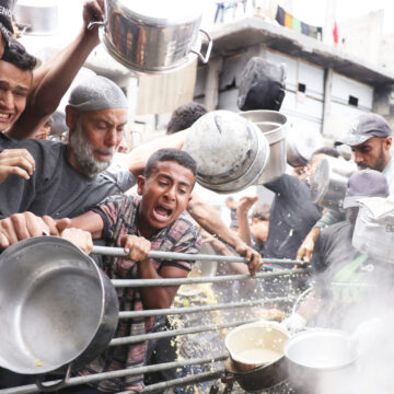 Gaza air strikes kill 94 as manhunt unfolds in West Bank