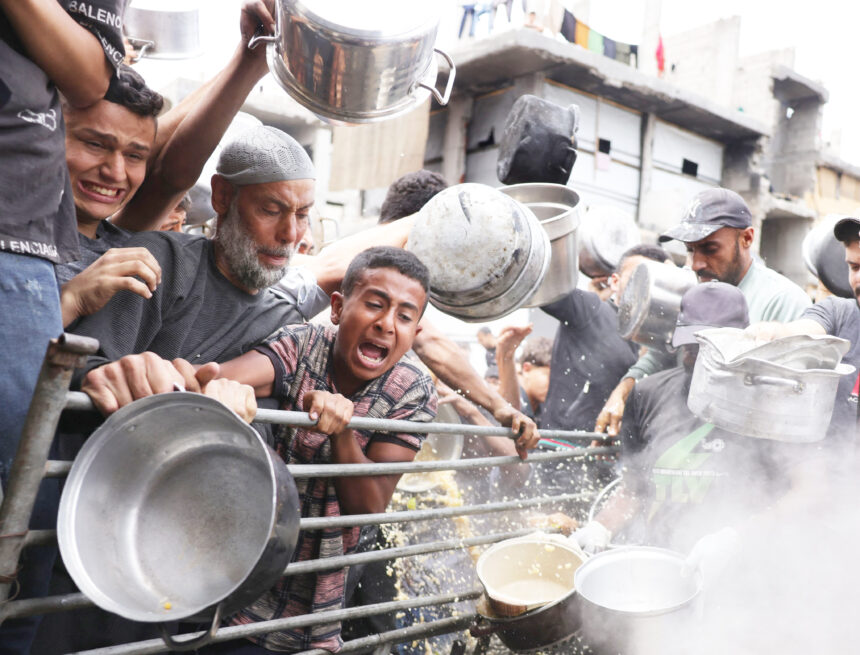 Gaza air strikes kill 94 as manhunt unfolds in West Bank