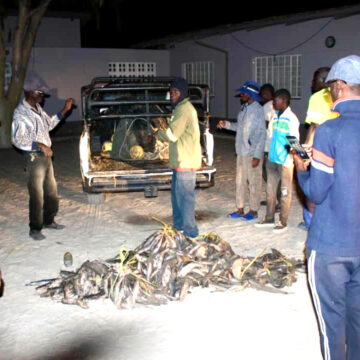 Residents fish in sewage pond