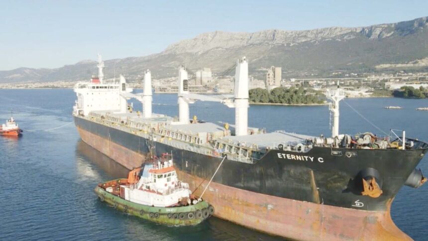 Damaged ship under fire in Red Sea 