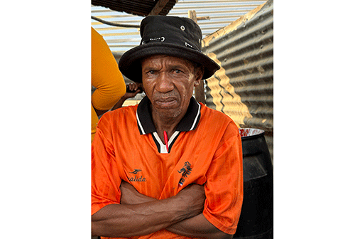 IMG_0455 Father left to care for 7 orphaned grandchildren